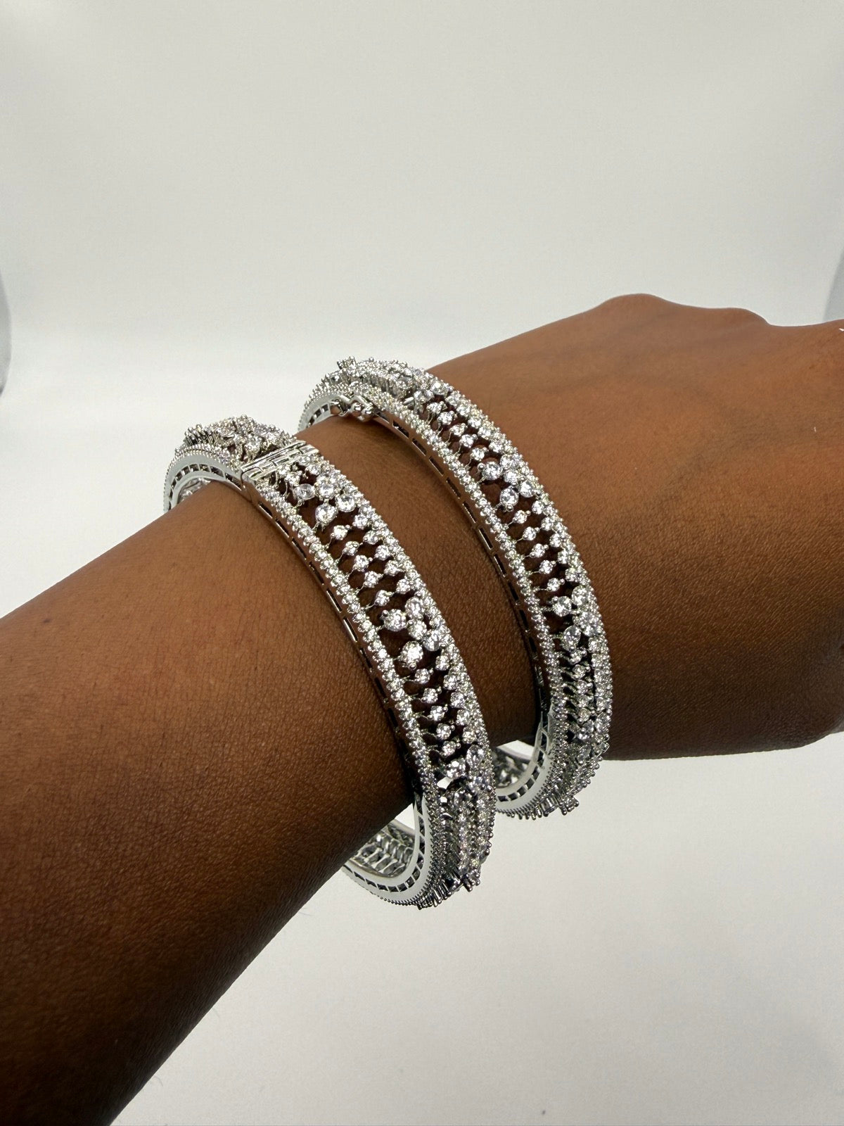 Silver-tone cubic zirconia statement bangle pair, additional angle