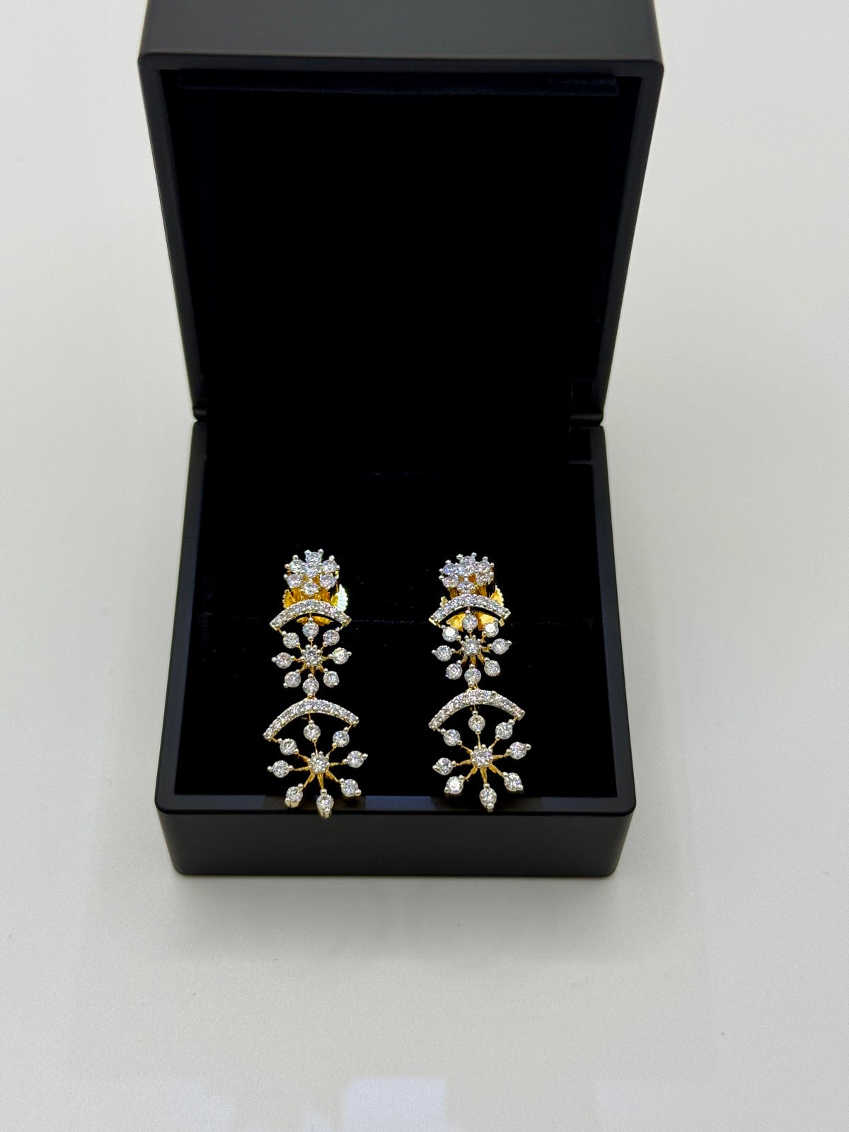 Gold-plated cubic zirconia snowflake drop earrings, additional angle