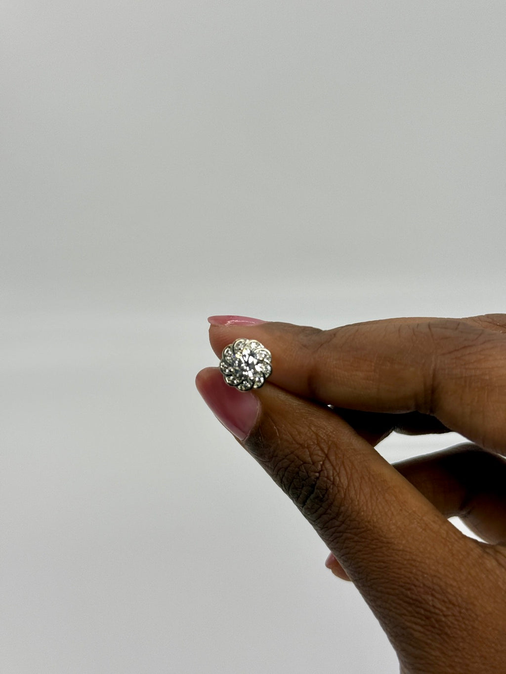 Silver-tone cubic zirconia floral stud earrings, additional angle