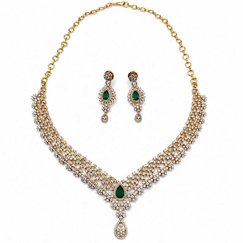 Layered gold-plated cubic zirconia necklace and earring set in emerald green, front view
