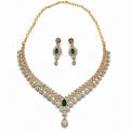 Layered gold-plated cubic zirconia necklace and earring set in emerald green, front view