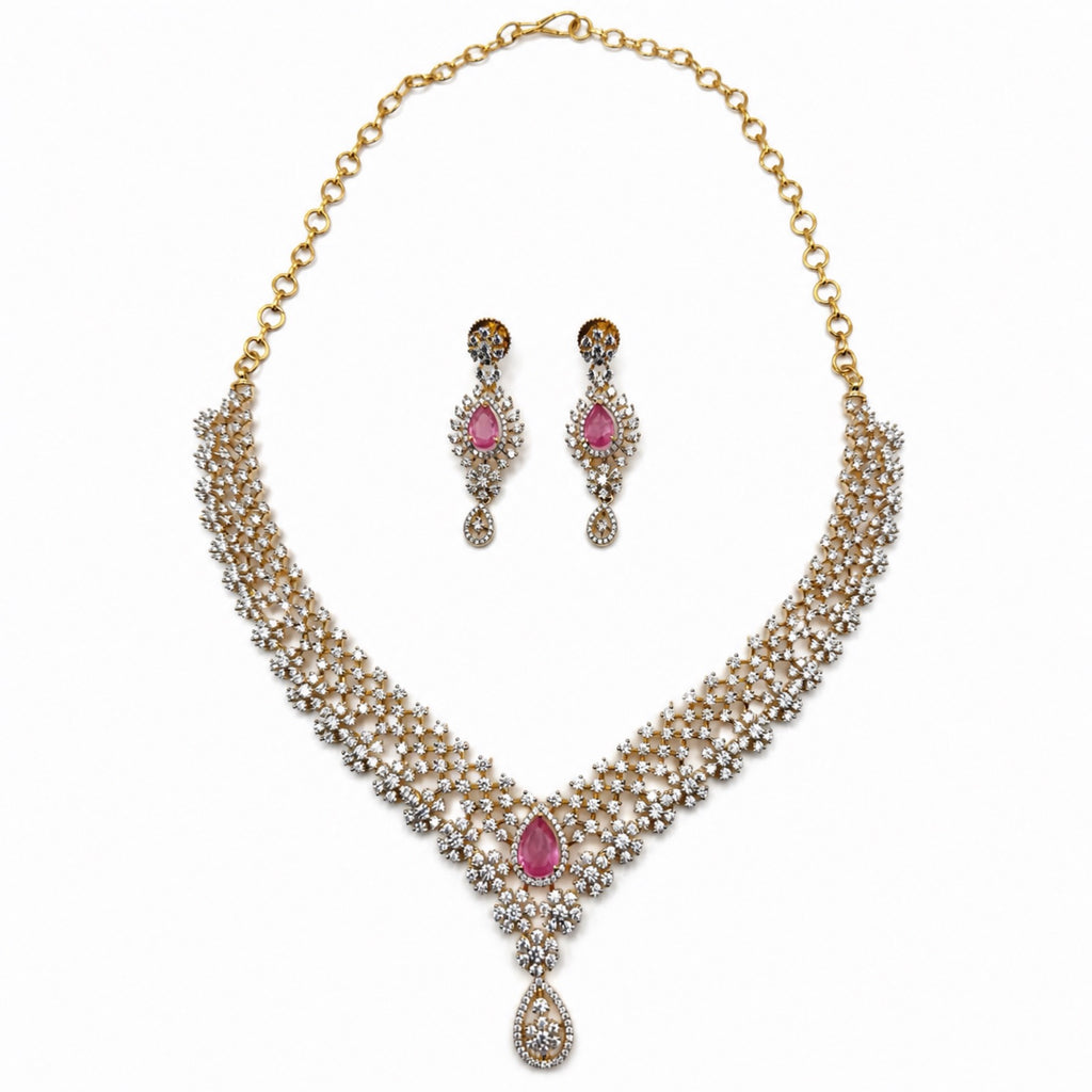 Layered gold-plated cubic zirconia necklace and earring set in blush pink, front view