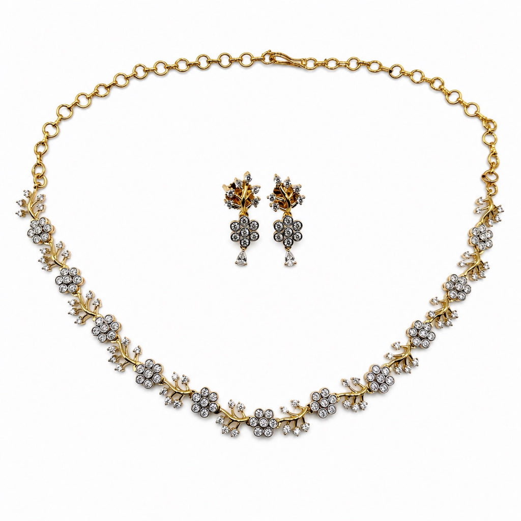 Delicate gold-plated cubic zirconia floral necklace and earring set, front view