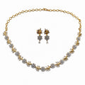 Delicate gold-plated cubic zirconia floral necklace and earring set, front view