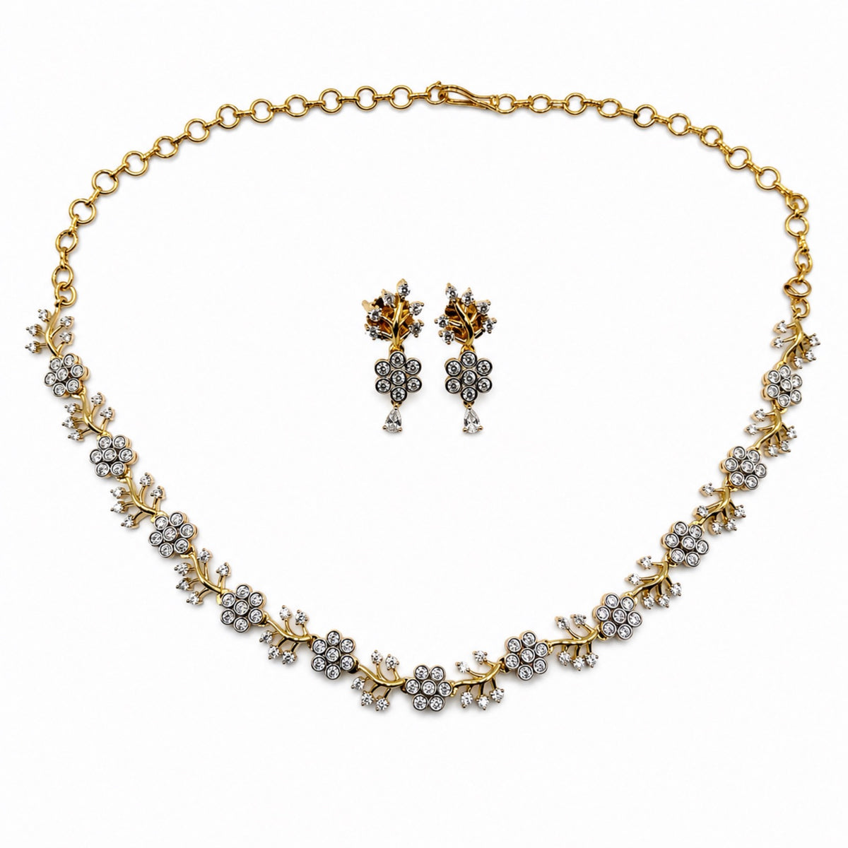Delicate gold-plated cubic zirconia floral necklace and earring set, front view