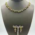 Delicate gold-plated cubic zirconia floral necklace and earring set, close-up detail
