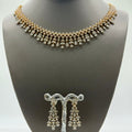 Gold-plated cubic zirconia teardrop necklace and earring set, close-up detail